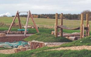 a playground with a swing set and a slide at Olavat Cottage detached property with parking in Inverness