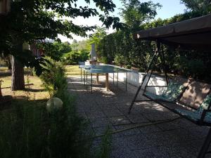 a glass table with a lamp on it in a yard at San Casciano, tra Stifone,le mole e le goledelNera in Narni