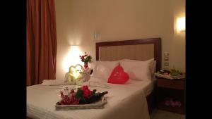 Postel nebo postele na pokoji v ubytování Hotel Karagianni