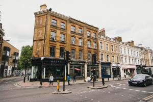 a large brick building on a city street at D8 - Shoreditch in London