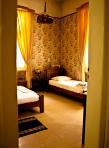 Llit o llits en una habitació de Acropolis House