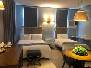 Uma cama ou camas num quarto em Hotel Lorenza
