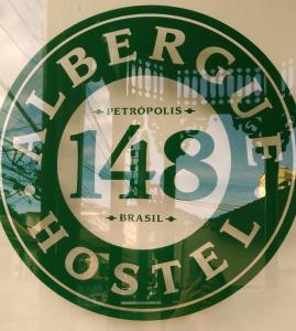 a sign on a wall with the words berg ice house at hostel 148 in Petrópolis