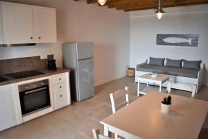 A kitchen or kitchenette at Arsinoi Apartments