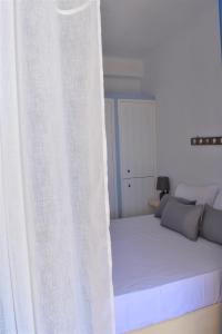 Postel nebo postele na pokoji v ubytování Arsinoi Apartments