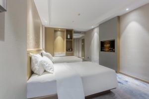 Ένα ή περισσότερα κρεβάτια σε δωμάτιο στο Byland Star Hotel