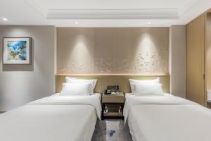 Ένα ή περισσότερα κρεβάτια σε δωμάτιο στο Byland Star Hotel