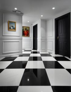 a room with a black and white checkered floor at Evripidou Suites in Athens