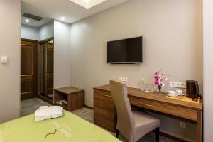 TV a/nebo společenská místnost v ubytování Renion Hills Hotel