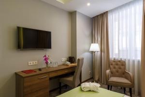 TV a/nebo společenská místnost v ubytování Renion Hills Hotel