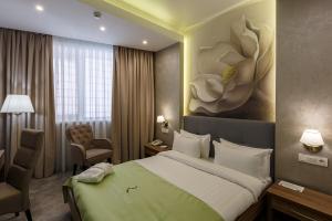 Postel nebo postele na pokoji v ubytování Renion Hills Hotel