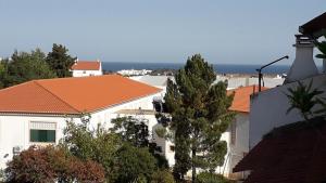 a view of a city with houses and trees at Vista Real in Vila Nova De Cacela