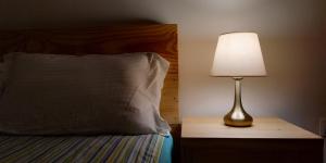 A bed or beds in a room at Sayami Home