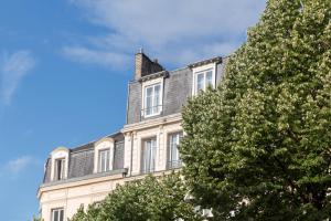 a building with a chimney on top of it at Best Western Hotel Centre Reims in Reims