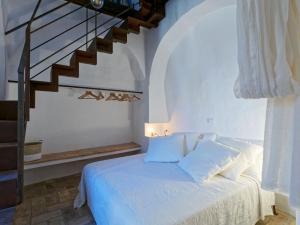 Voodi või voodid majutusasutuse L’Arrocco - La Torre col Mare sul Tetto toas