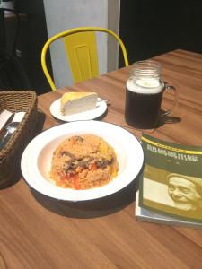 a table with a plate of food and a book at 在路上 in Lukang +13 photos