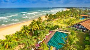 an aerial view of a resort with a pool and a beach at Thaala Bentota in Bentota