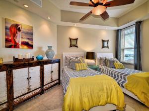 a bedroom with two beds and a ceiling fan at Belle Harbor 701W Luxury Condo with Panoramic Water View. 23088 in Clearwater Beach +23 photos