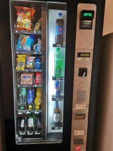 a refrigerator filled with lots of drinks and drinks at Stadthotel Hauser Eck in Sankt Pölten