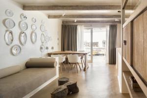 a living room with a couch and a table at Nautilus Lanzarote in Puerto del Carmen +243 photos