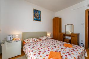 Postel nebo postele na pokoji v ubytování Holiday House Snjezana
