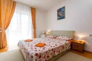 Postel nebo postele na pokoji v ubytování Holiday House Snjezana