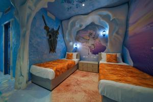 Postel nebo postele na pokoji v ubytování Gardaland Magic Hotel + 19 fotografií