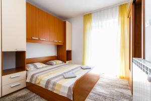 Postel nebo postele na pokoji v ubytování Holiday House Snjezana