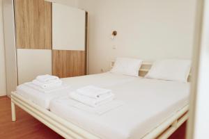 Postel nebo postele na pokoji v ubytování Apartments Ana Sutivan