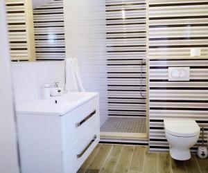 Koupelna v ubytování Apartments Ana Sutivan + 18 fotografií