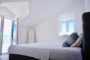 Postel nebo postele na pokoji v ubytování Apartments Ana Sutivan