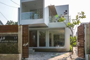 a modern house with glass doors in front of it at RedDoorz near Universitas Islam Indonesia in Yogyakarta