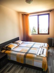 Postel nebo postele na pokoji v ubytování Aparthotel Pine Hills Pamporovo