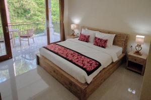 Postel nebo postele na pokoji v ubytování Gek House Ubud Bali + 37 fotografií