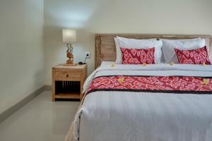 Postel nebo postele na pokoji v ubytování Gek House Ubud Bali