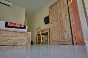 TV a/nebo společenská místnost v ubytování Gek House Ubud Bali