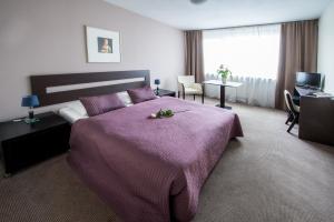 Postel nebo postele na pokoji v ubytování Hotel Cascade