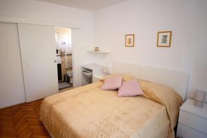 Posteľ alebo postele v izbe v ubytovaní Apartments Polenta