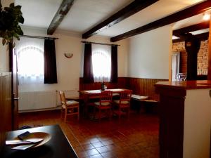 a dining room with a table and chairs at Ubytování Medlov in Moravská Nová Ves