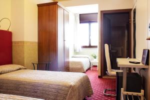 Posteľ alebo postele v izbe v ubytovaní Albergo Ristorante Belvedere