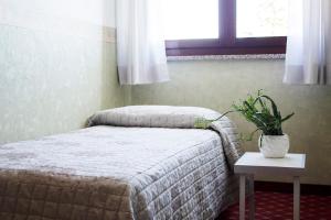 Posteľ alebo postele v izbe v ubytovaní Albergo Ristorante Belvedere