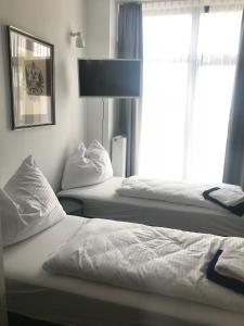 Postel nebo postele na pokoji v ubytování Sissi Apartments