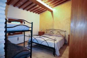 Postel nebo postele na pokoji v ubytování Agriturismo la Tana