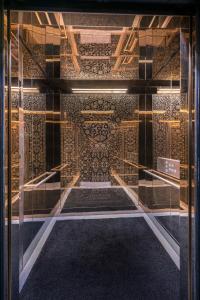 a glass display case with a room with a ceiling at The Prestige Hotel Penang, a Member of Design Hotels in George Town +53 photos