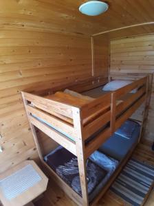 a bunk bed in a sauna in a cabin at Domek Irenka in Puck