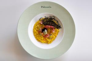 a white plate with a dish of food on it at Grand Hotel Portovenere in Portovenere