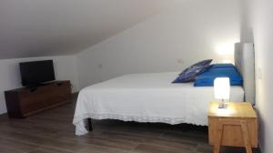 Postel nebo postele na pokoji v ubytování Santa Lucia B&B