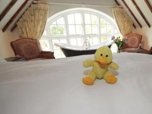 a teddy bear sitting on top of a table at Cherry Orchard Farm in Bath