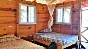 Cama o camas de una habitación en Enjoy San Blas - Isla Diablo (Guna Yala)