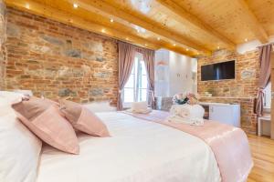Postel nebo postele na pokoji v ubytování New Lux Villa Merissima